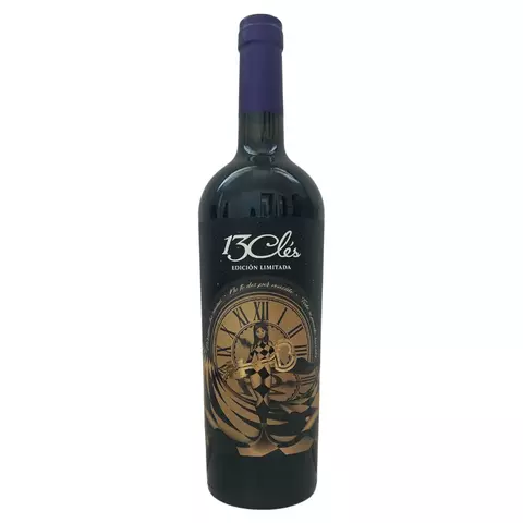 Botella de vino tinto 13 Clés Edición Limitada con etiqueta negra y dorada que muestra un reloj antiguo y una figura femenina sosteniendo una llave dorada