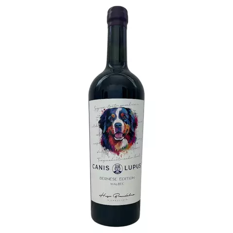 Botella de vino tinto Canis Lupus Bernese Edition Malbec con etiqueta ilustrada de un perro Bernés