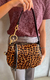 Imagem do Bolsa Tiracolo Animal Print Onça Média Soft