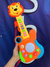 Juguete Guitarra leon Musical Luz Sonido - comprar online