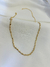 Choker texturizada torcida dourada