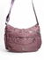 Bolsa feminina transversal média na cor rosa com vários zíperes e alça ajustável.