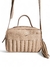 Bolsa feminina transversal baú nude em couro legítimo com alça longa e detalhes em franjas.