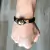 PULSEIRA PRETA LISA CAVEIRA BANHO OURO - buy online