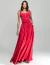 Mulher vestindo conjunto bordado vermelho Raw, composto por blusa com detalhes em pedrarias e saia longa, ideal para eventos sofisticados.