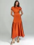 Mulher vestindo vestido midi fluido terracota Nocturne Charm, com modelagem elegante e tecido acetinado, ideal para ocasiões especiais.