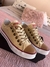 Imagen de converse sin plataforma beige con puntera marron