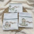 Kit Naninha e 3 fraldinhas Chocalho Dinossauro - comprar online