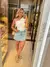 Short Saia Jeans Claro com Barra Desfiada - comprar online