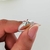 Anillo con cruz central en microzirconias colores
