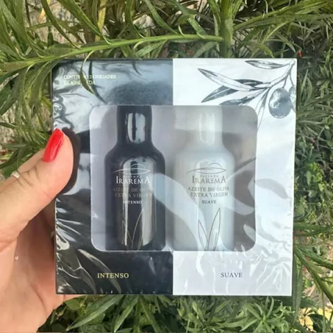 Kit com duas garrafas de azeite extra virgem da marca Irarema, uma com rótulo preto e outra com rótulo branco, destacando os sabores intenso e suave.