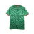 Camisa verde da Seleção do México para a Copa de 2026, modelo torcedor masculino da Adidas com detalhes em vermelho e estampa gráfica inspirada na cultura mexicana