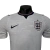 Camisa oficial da Seleção da Inglaterra para a Copa de 2026, modelo jogador masculino da Nike, na cor branca com detalhes em vermelho e escudo da equipe no peito