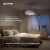 Ventilador de techo retráctil de 4 aspas diseño liso instalado en un dormitorio moderno, con luz LED y mobiliario de estilo minimalista.