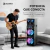 Torre de sonido parlante SUONO de 2 woofers de 10 pulgadas con luces RGB y 14500W de potencia, en un living moderno con un joven tocando la guitarra eléctrica.