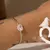 BRACELETE CORAÇÃO FUSION QUARTZO ROSA COM ZIRCÔNIAS BRANCAS