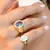 ANEL OVAL ESTRELAS DE CRISTAL LONDON BLUE E ZIRCÔNIAS BRANCAS - loja online