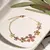 PULSEIRA FLORAL DE CRISTAL TOPÁZIO AZUL, CRISTAL AMETISTA, CRISTAL TURMALINA ROSA E ZIRCÔNIAS COLORIDAS 20CM - comprar online