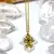 Conjunto de cadena con dije en acero dorado quirúrgico