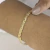 Pulseira Trançada com Três Fios Banhado em Ouro 18k - Céu de Prata