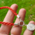 Imagen de Pulsera Plata Hilo Seda Rojo con Dije Virgen de Guadalupe Marinero cod4028