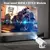 Mini projetor Magcubic Android 11 projetando uma imagem em uma parede, mostrando motociclistas em uma corrida futurista.