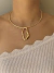 Choker e brinco dourado orgânico na internet