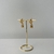 Brinco Folheado a Ouro 18k argola com pingente e ponto de luz - comprar online
