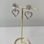 Brinco Folheado a Ouro 18k flor com coração - comprar online