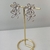 Brinco Folheado a Ouro 18k flores vazadas prata - comprar online