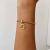 Pulseira folheada com coração vazado e zirconias - comprar online