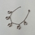 Pulseira aço inox com pingente de ferraduras