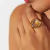 ANEL COM CRISTAL OVAL BANHADO A OURO - comprar online