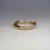 Argola cliker transpassada lisa e cravejada 1.2x12 - Titânio PVD Gold
