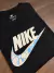 Camiseta Nike Sportswear com Splash Água Preta na internet
