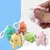 LLAVERO SQUISHY DINO CON PELOTITA