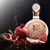 Perfume feminino ÁRABE Fakhar Rose Lattafa ao lado de romã e sementes de romã, com fundo preto e gotas de água, destacando a embalagem sofisticada com detalhes dourados.
