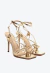 Eleve seu estilo com a sandália couro ouro light Cecconello. Salto alto de 11cm, detalhes exclusivos e brilho sofisticado. Garanta seu destaque agora!
