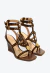 Sandália couro marrom Cecconello com salto alto anabela, recortes a laser e tachas douradas. Aposte em elegância e conforto. Garanta já a sua!
