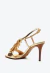 Sandália couro ouro light Cecconello com salto alto, miçangas e tira ajustável. Destaque-se em festas e eventos especiais. Compre e brilhe com elegância!