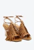 Sandália couro marrom anabela com franjas e metais, salto alto confortável. Estilo boho chic para looks modernos. Garanta já a sua Cecconello!