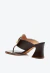 Tamanco em couro marrom, salto médio bloco, detalhe dourado. Sofisticação e conforto para looks versáteis. Garanta o seu Cecconello!