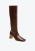 Bota feminina em couro marrom, cano longo, salto bloco baixo. Sofisticação, conforto e design moderno. Garanta já sua Cecconello!