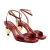 Sandália em couro vermelho com salto coração dourado. Design sofisticado, ajuste perfeito e destaque para ocasiões especiais. Garanta já a sua!