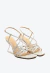 Sandália de couro branco com tiras finas e salto acrílico geométrico. Design sofisticado, ideal para festas e eventos. Garanta já a sua Cecconello!