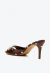 Tamanco em cetim poá marrom, salto médio de 7,5cm e design elegante. Perfeito para looks sofisticados. Garanta já o seu Cecconello!