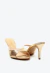 Tamanco em couro ouro light com salto fino médio de 7,5cm, bico folha e recorte anatômico. Luxo minimalista para festas e looks sofisticados. Garanta já o seu!