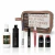 Set de maquillaje completo Regina con estuche transparente y varios productos de belleza, incluyendo base, labial, máscara de pestañas, aceite labial y rubores en barra.
