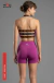 Modelo de espaldas usando short deportivo color orquídea y top deportivo con tiras negras con logo MIRO SPORTS