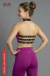 Modelo de espaldas usando conjunto deportivo orquidea largo color violeta con top sin mangas y detalles en negro con logo Miro Sports